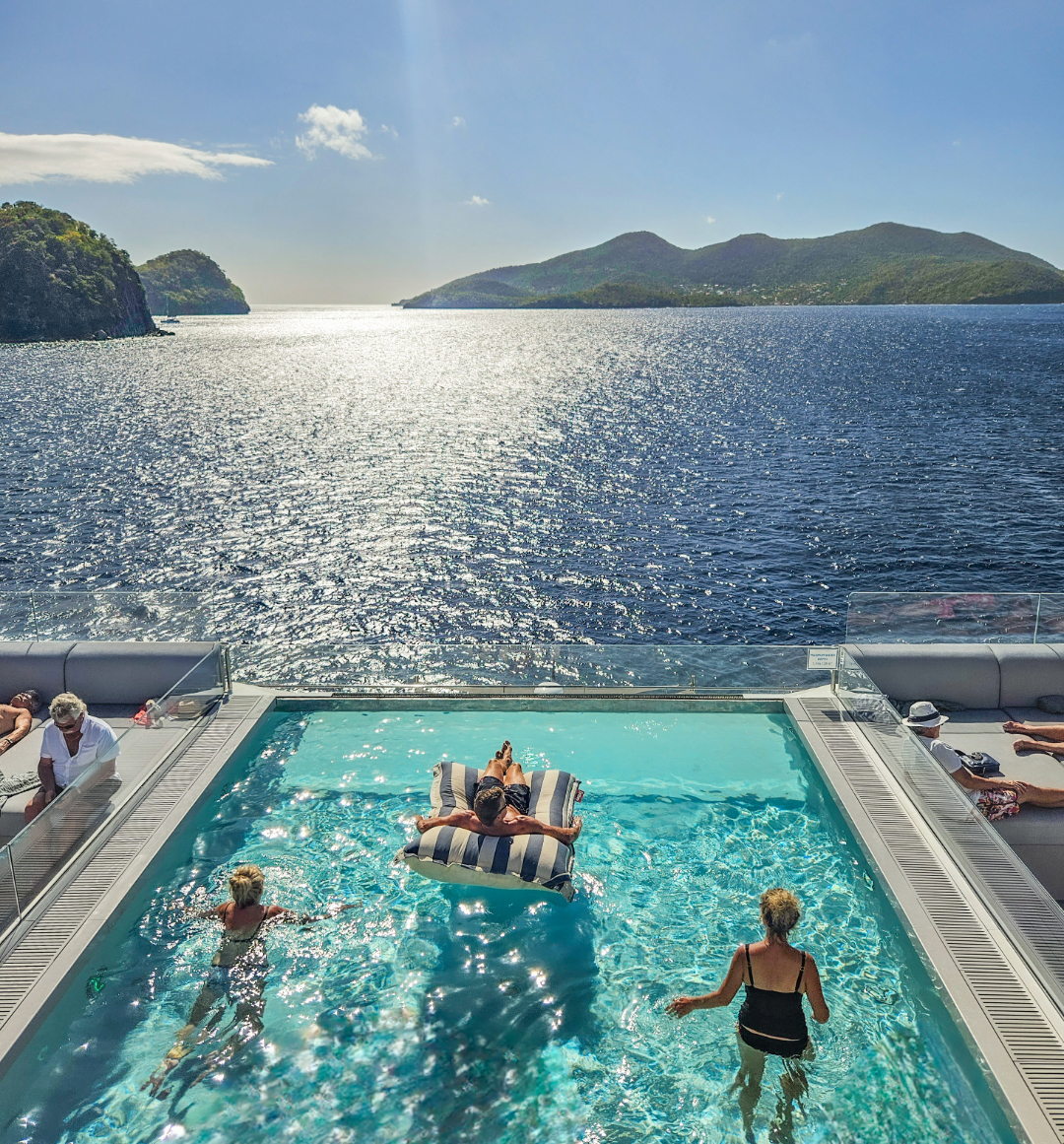 Swimming pool on-ship overlooking caribbean ocean scenery
