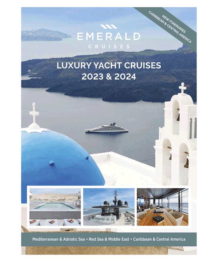 A luxury yacht cruise brochure cover, featuring a yacht sailing the seas of Santorini in front of the blue-domed church 