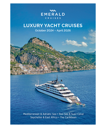 A luxury yacht cruise brochure cover, featuring a yacht sailing the seas off the coast of an island