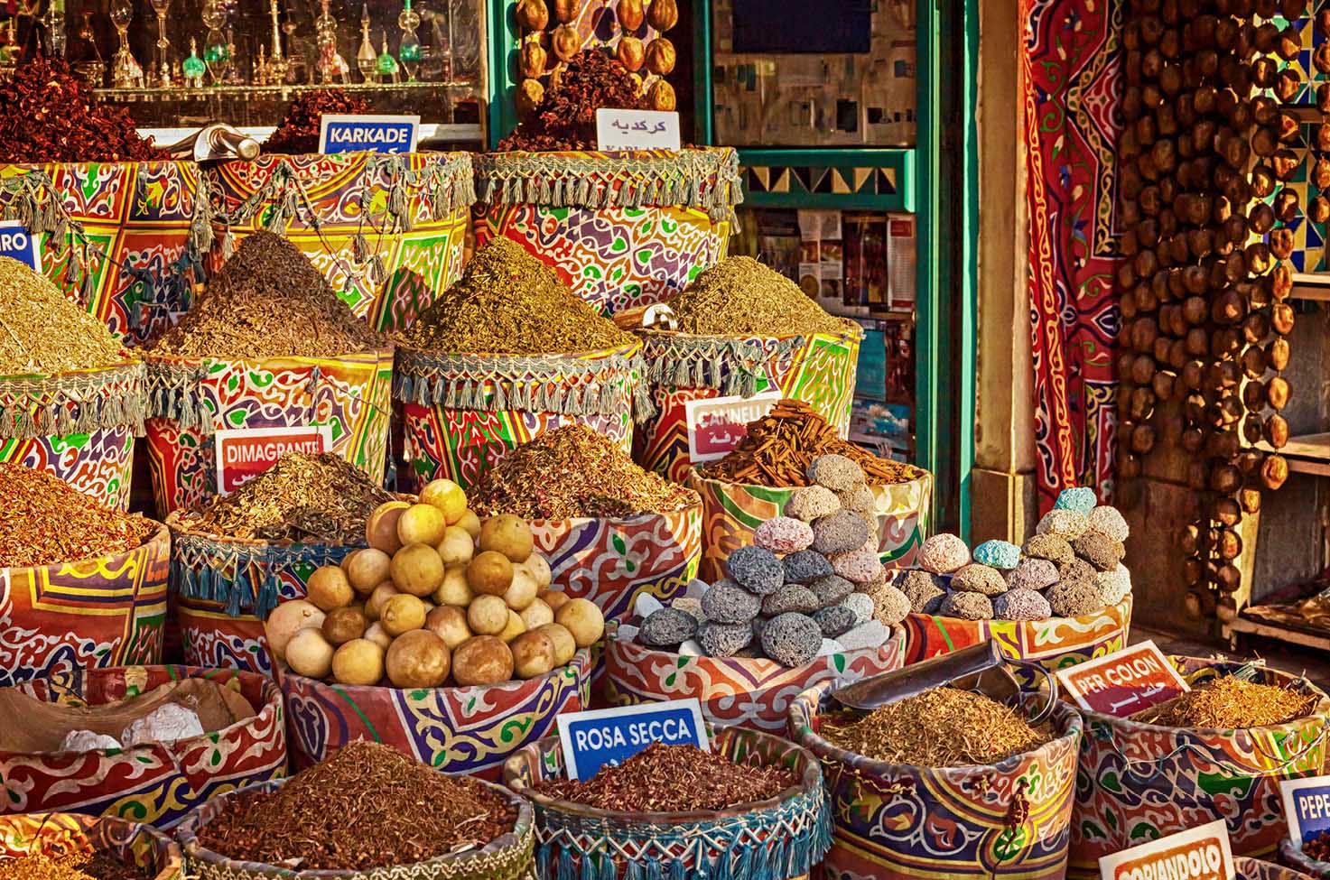 a group of colourful baskets of spices at the Sharm el Sheikh markets