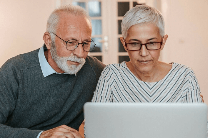 couple sitting with laptop