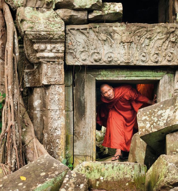 Buddhist monks exploring Angkor Wat