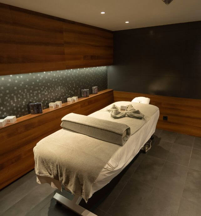 Spa treatment room with massage table