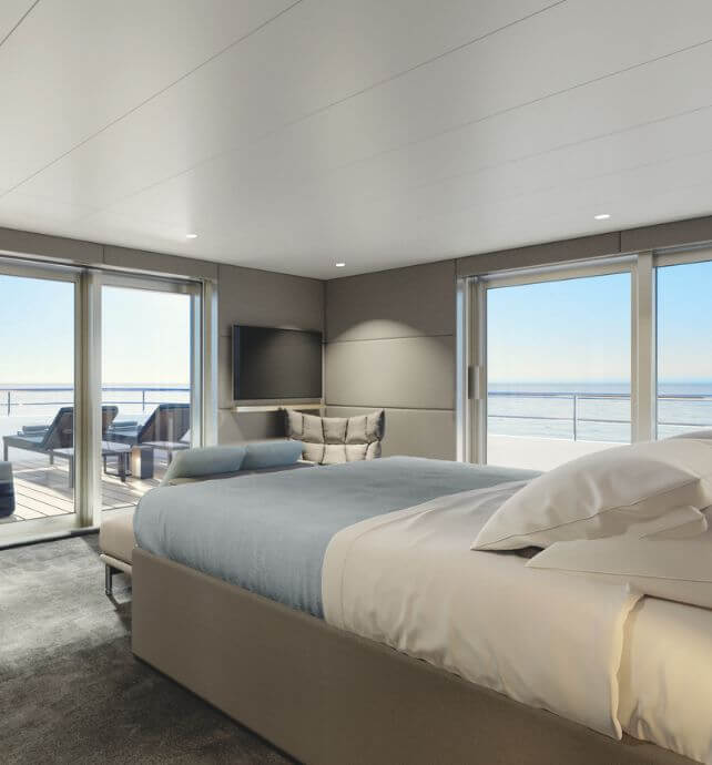 Spacious yacht suite with ocean views aboard Emerald Azzurra