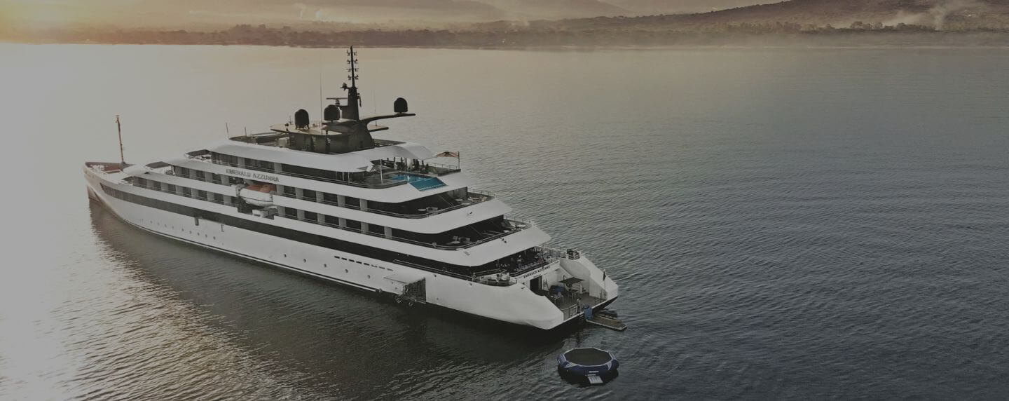 Yacht Emerald Azzurra anchored on calm waters at sunrise