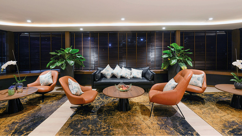 Cosy lounge area on board a luxury river ship on the Mekong in Southeast Asua