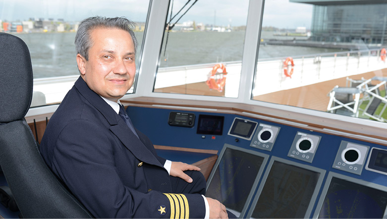 Captain sailing on board a luxury river ship
