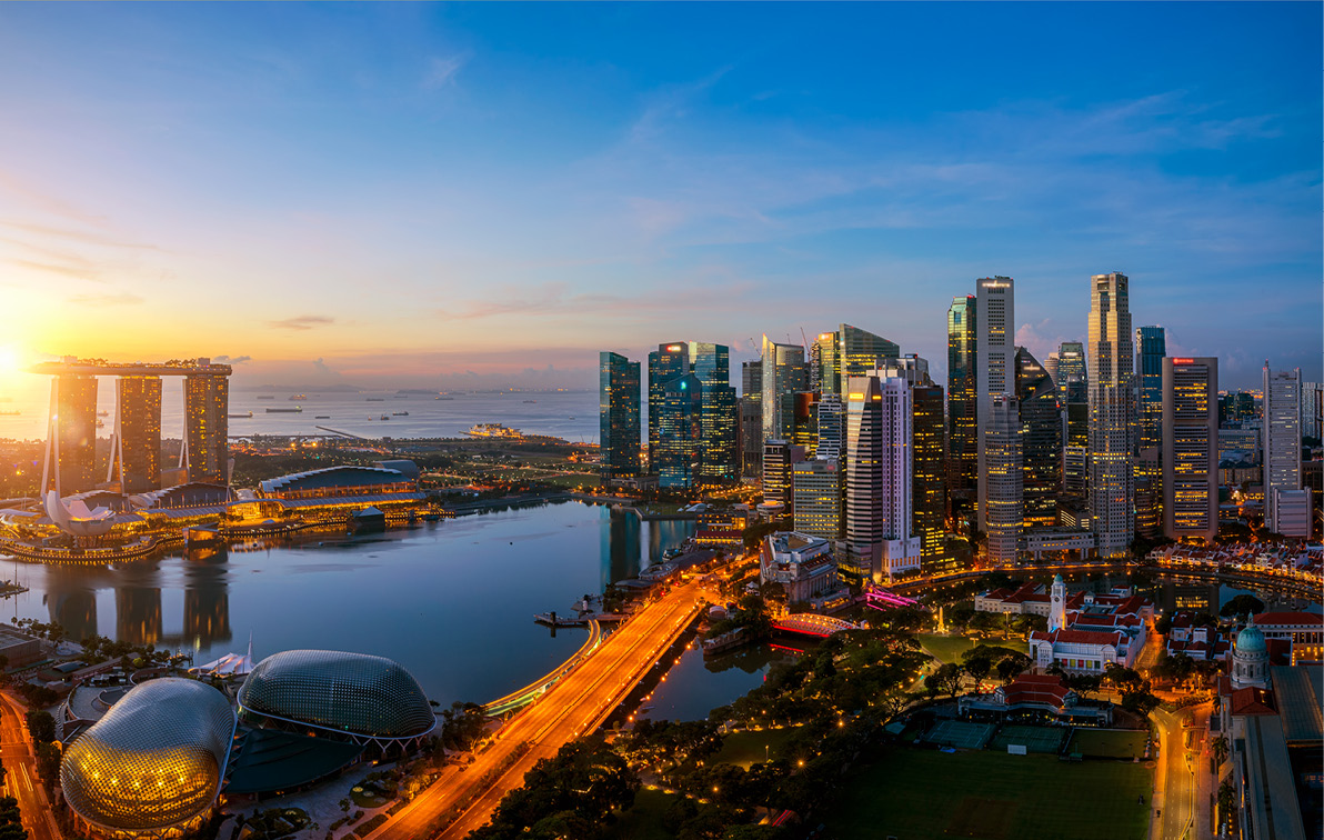 The bright city lights of Singapore at sunset