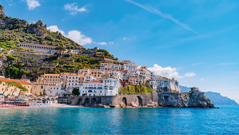 The stunning coastline of the Amalfi Coast, with traditional houses built up against the cliff edge